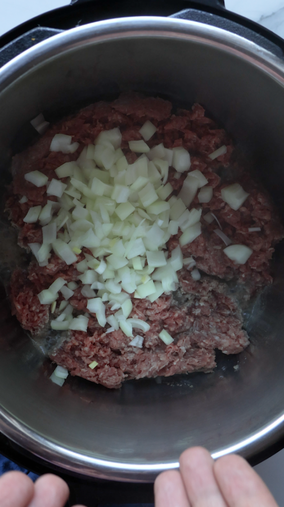 onions being sautéed with beef